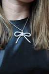 Rhinestone Bow Pendant Necklace | Silver AB