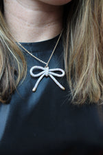 Rhinestone Bow Pendant Necklace | Silver AB