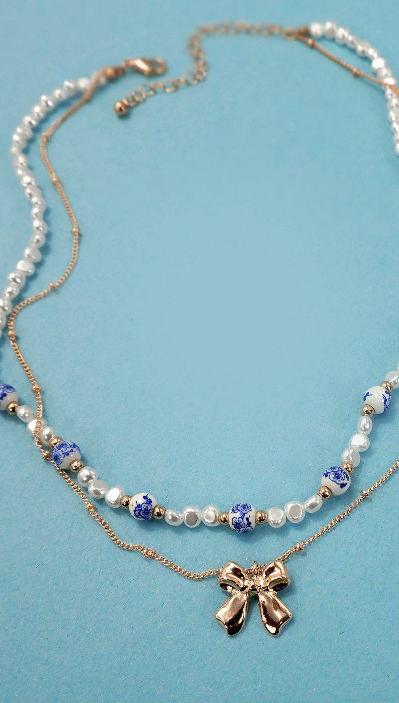CERAMIC PORCELAIN PEARL BOW LAYER NECKLACE | 80N91555: Gold