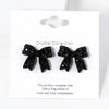 Pave bow stud earrings
: Jet