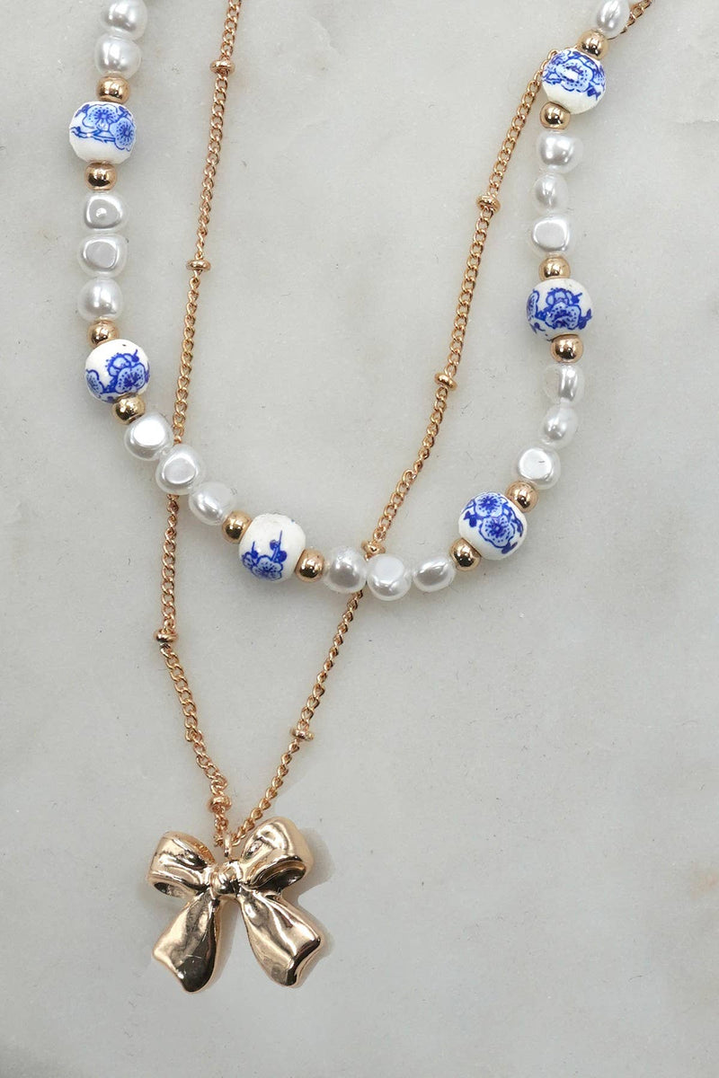 CERAMIC PORCELAIN PEARL BOW LAYER NECKLACE | 80N91555: Gold